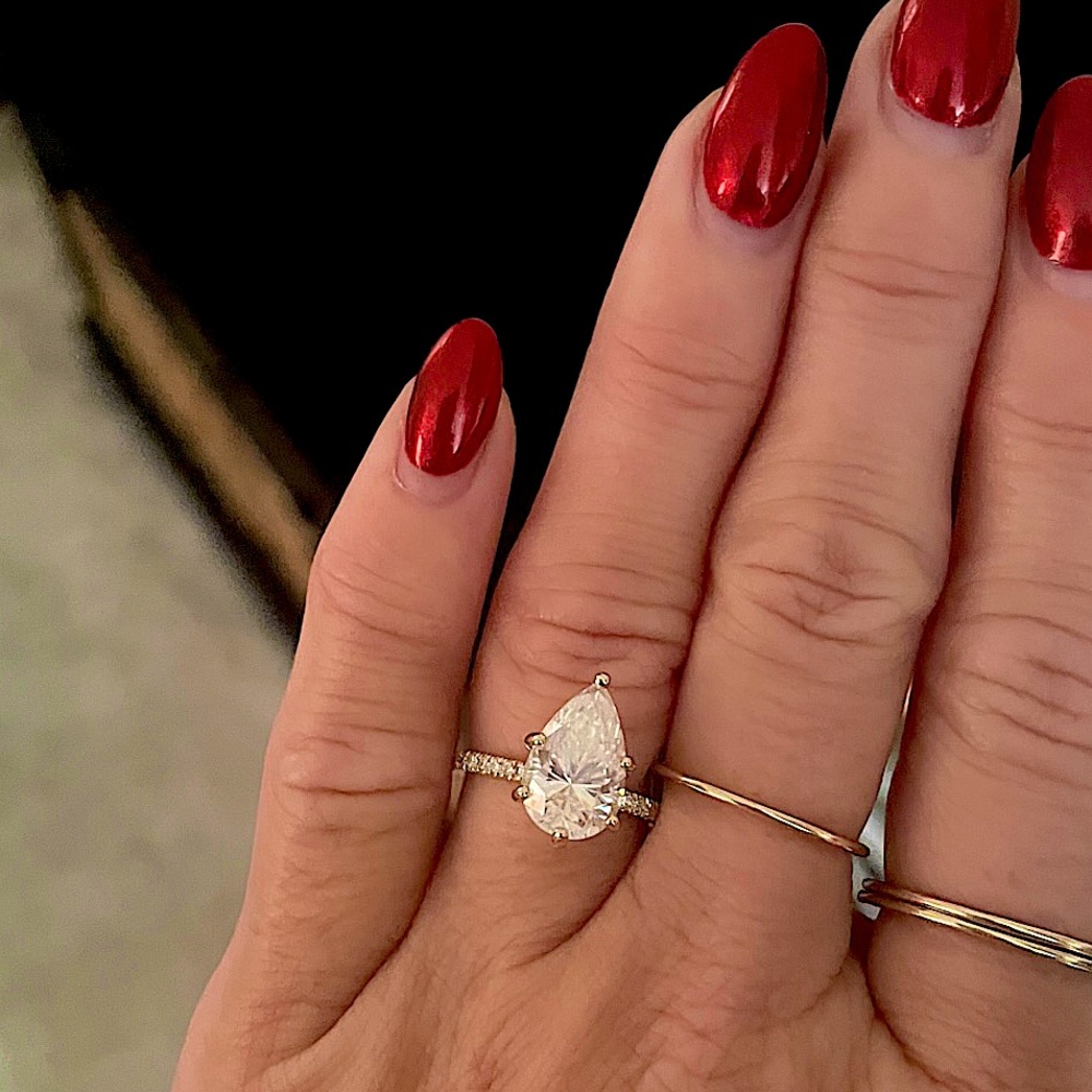 2.5 Carat Moissanite Pear Shaped Ring with real
diamonds on the 14k band.